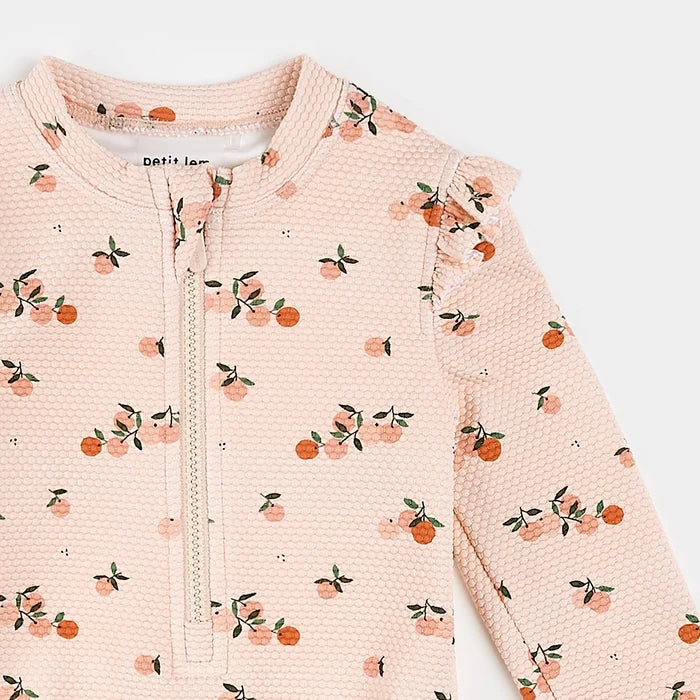 Petit Lem long sleeve baby swimsuit orange print close-up detail