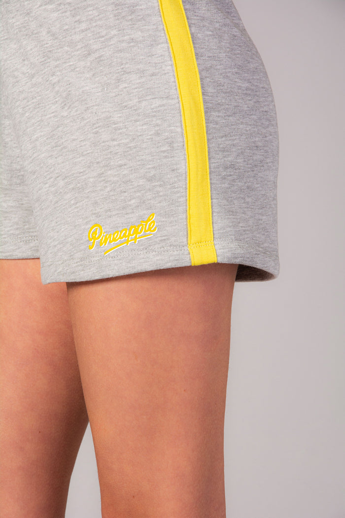 Kids' sport shorts in marl grey with elasticated waistband and yellow stripe detail.