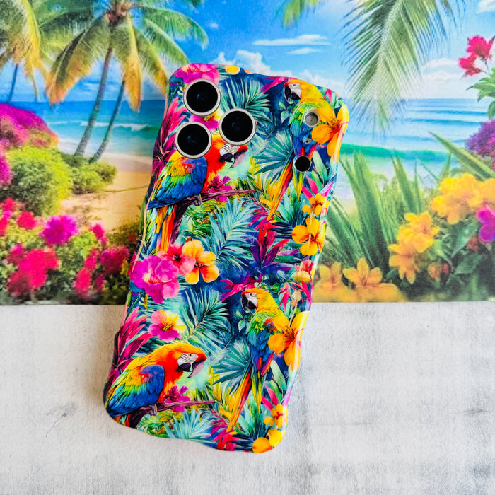 Trendy wavy iPhone case featuring a vibrant tropical pattern of red macaws, pink hibiscus, and green palm leaves with a high-gloss finish.