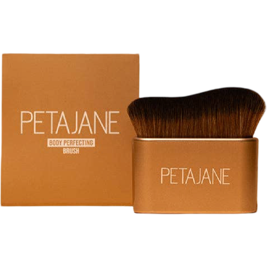 Petajane body perfecting brush with brown handle and black bristles on a white background