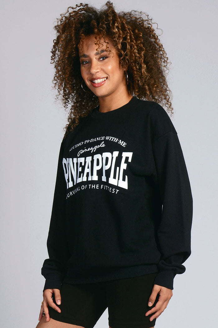 Woman wearing black Unisex Sweatshirt with white print logos