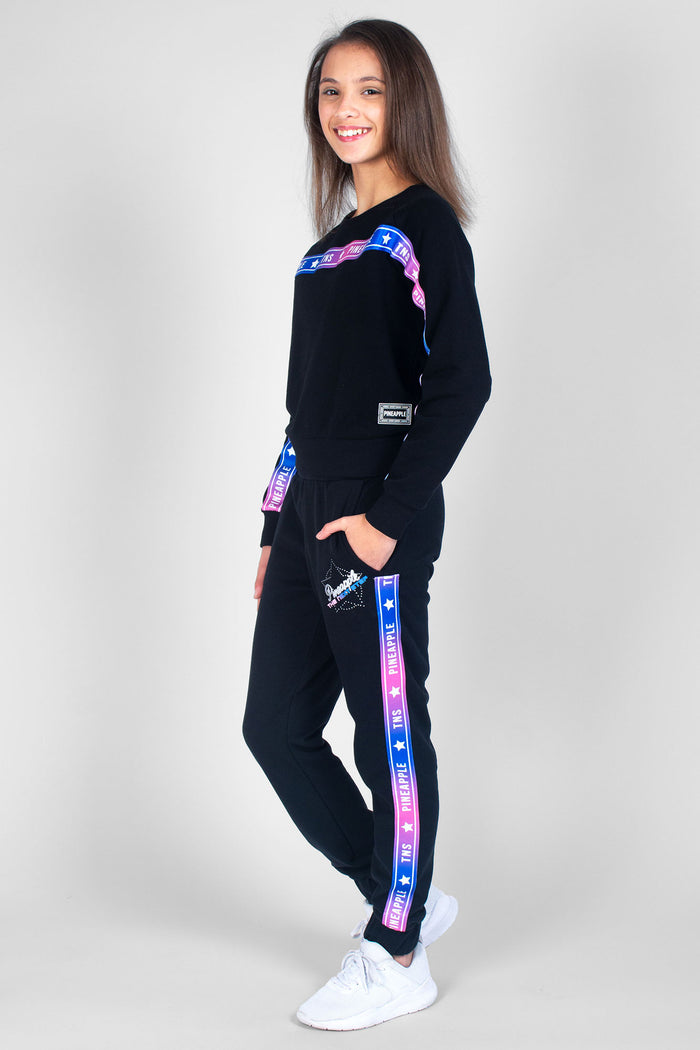 Girl wearing black TNS Tape Sweat Top and TNS Tape Joggers with ombre detailing