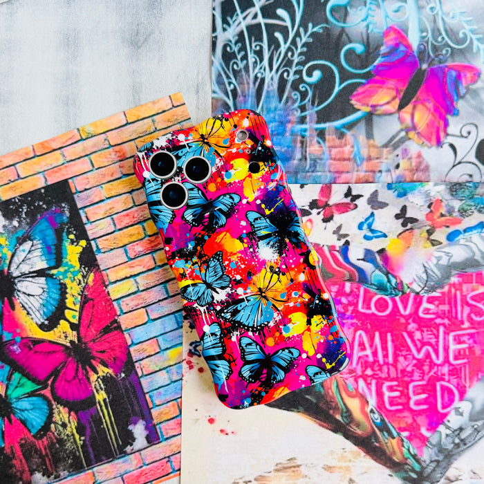 Trendy wavy iPhone case featuring a vibrant street-art collage of electric blue and yellow butterflies over neon pink paint splatters with a high-gloss finish.