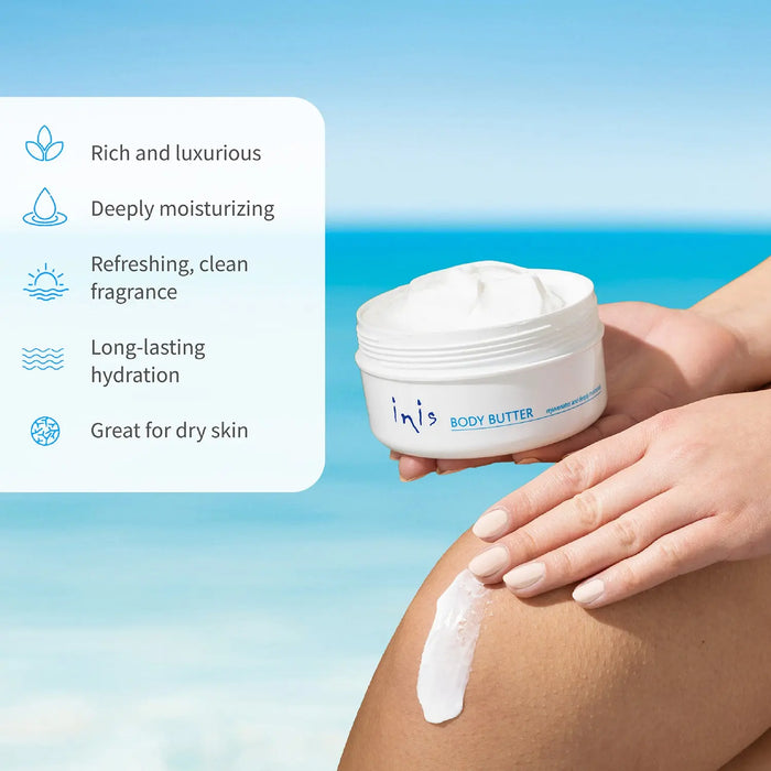 Person holding a jar of body butter and applying it to their leg with a blue sky background