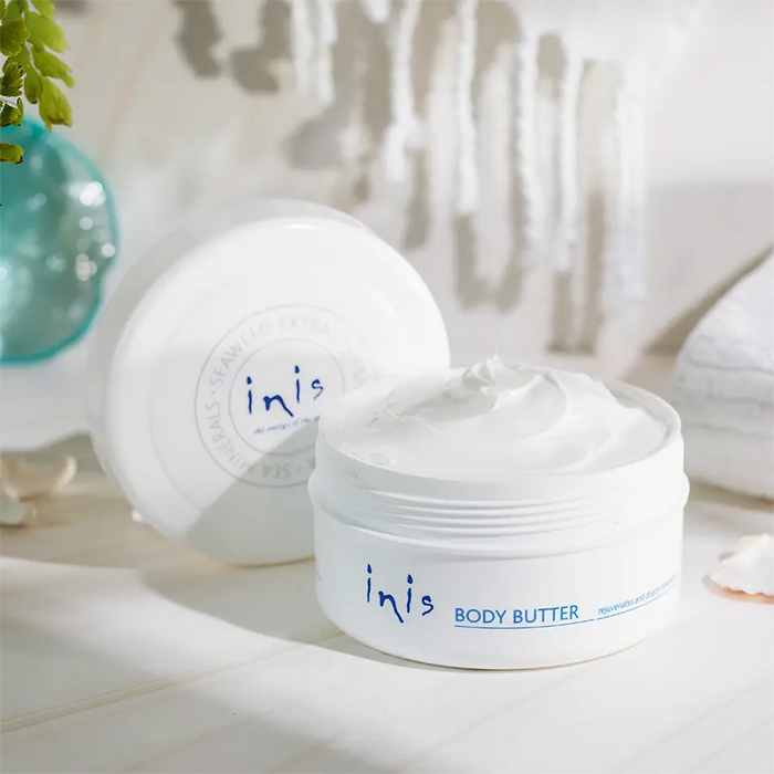 Inis body butter jar with a blurred background
