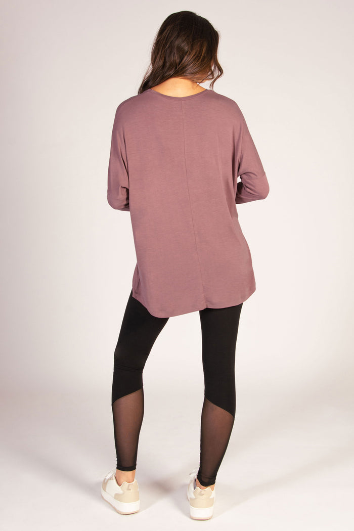 Dark brown long sleeve top for women featuring soft jersey fabric and dipped back.