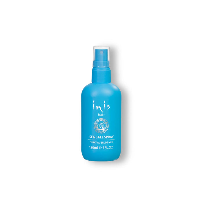 Blue spray bottle labeled 'inis' on a white background