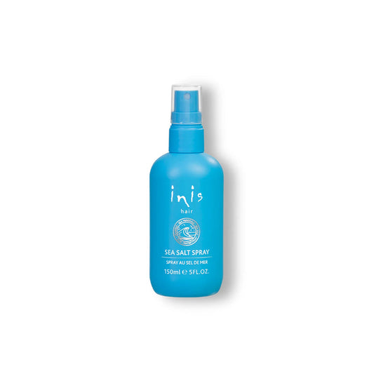Blue spray bottle labeled 'inis' on a white background