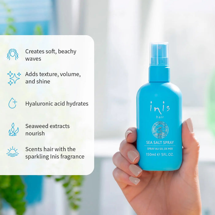 Blue bottle of Inis hair sea salt spray held by a hand with text detailing product benefits on the left side
