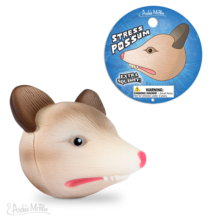 Stress Possum is a squishy polyurethane foam stress ball featuring brown ears and a pink nose, ideal for relieving stress. It's packaged in vibrant blue packaging.