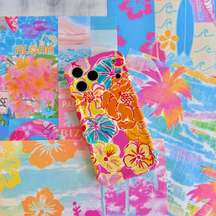 Trendy wavy iPhone case featuring a vibrant pink, orange, and teal hibiscus flower pattern with a high-gloss finish.