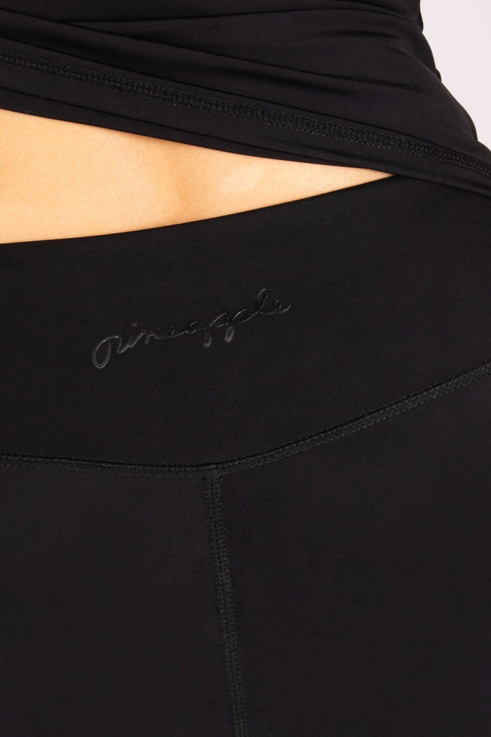 Detail shot of minimalistic Pineapple branding at the back of the wasitband
