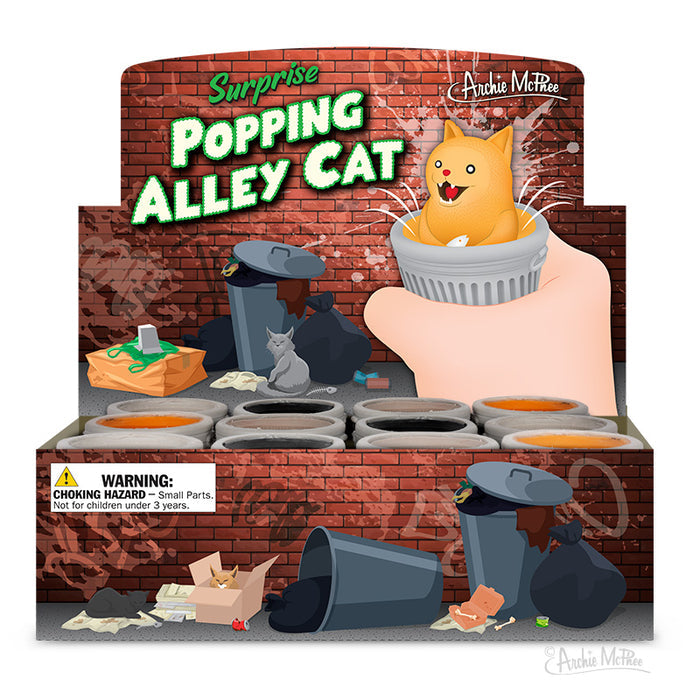 A charming toy display features the Surprise Popping Alley Cat figure, complete with its signature surprise popping action, surrounded by trash cans. Note the warning label advising caution against small parts.