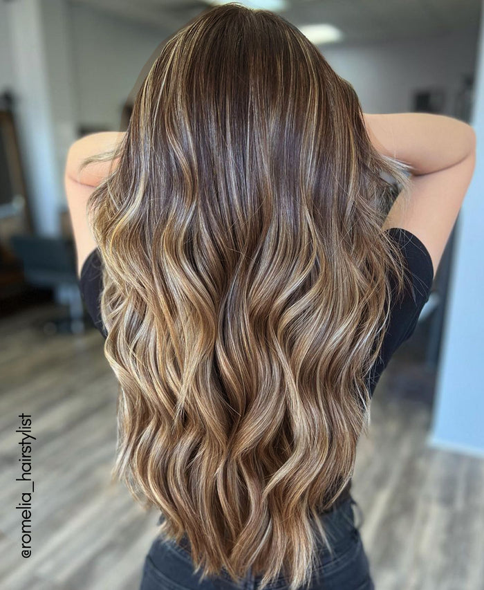 tape-in hair extensions caramel balayage.