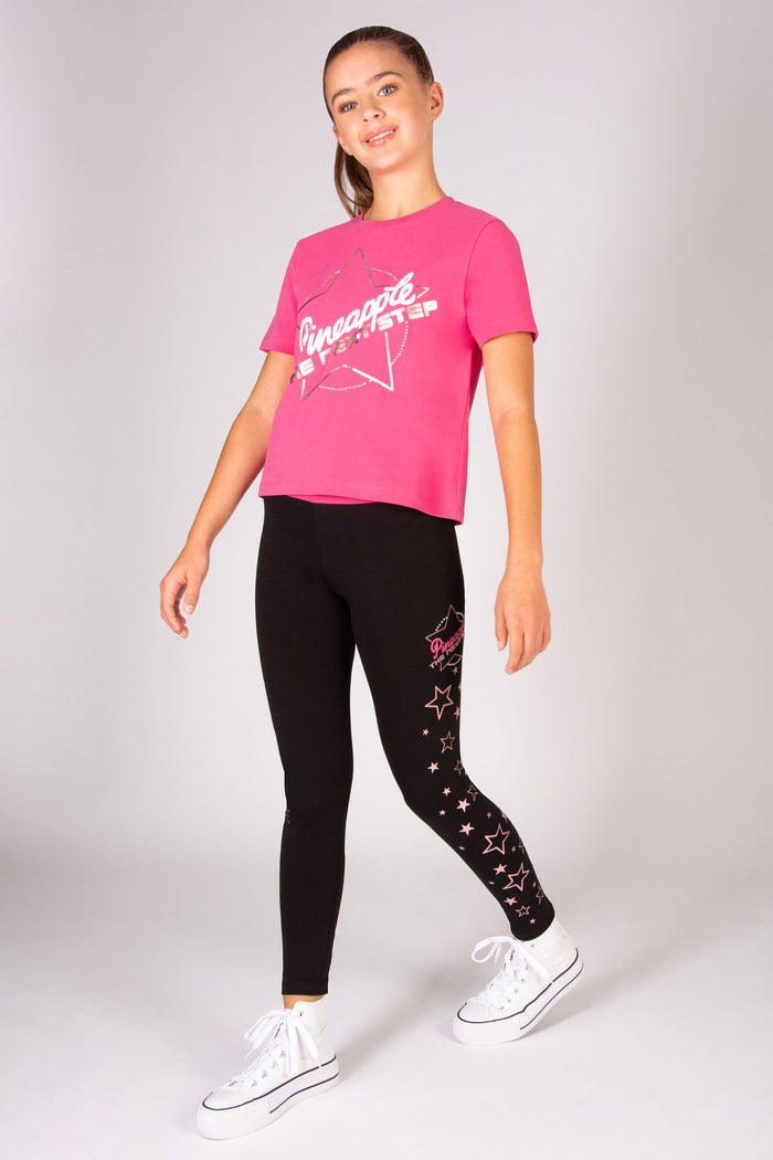 Girls' pink The Next Step dance t-shirt with matching leggings.