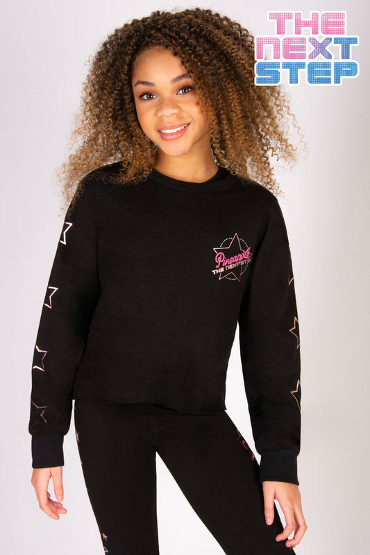 Girls' black crewneck jumper with a small The Next Step logo and stars along the sleeves.
