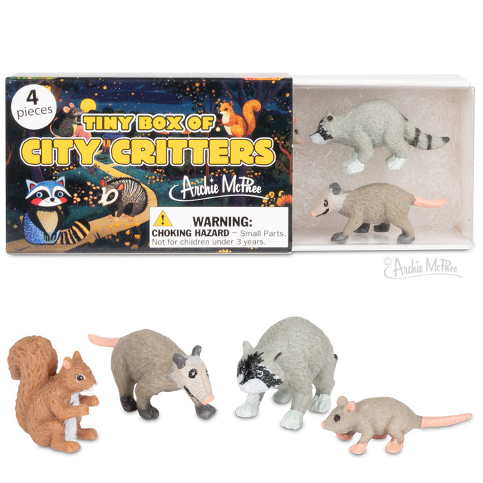 The Tiny Box of City Critters includes four miniature animal figurines: a raccoon, possum, squirrel, and rat with a labeled box in the background.