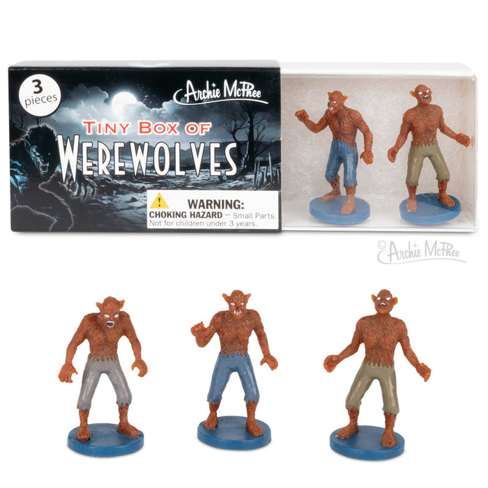 Box containing three werewolf figurines wearing blue, tan and grey shorts, sold as Tiny Box of Werewolves by Archie McPhee.