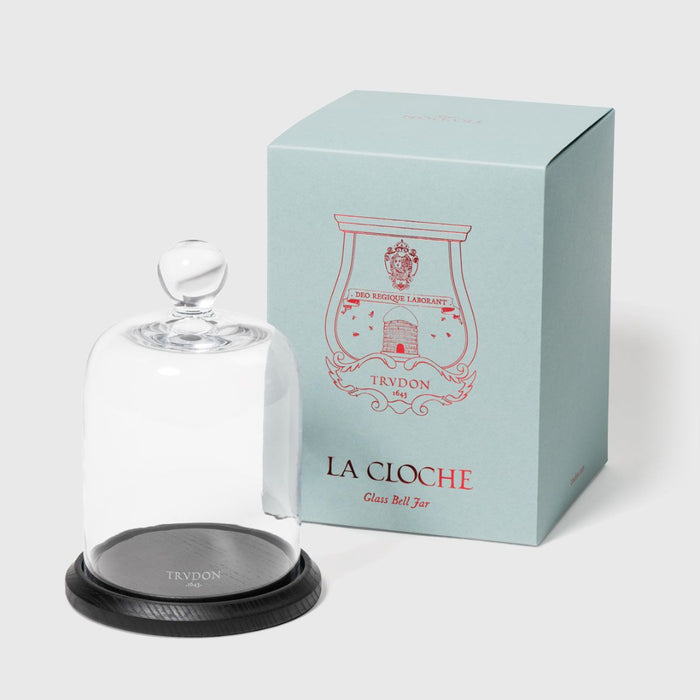La Cloche glass bell jar with Trudon branding on a light gray background