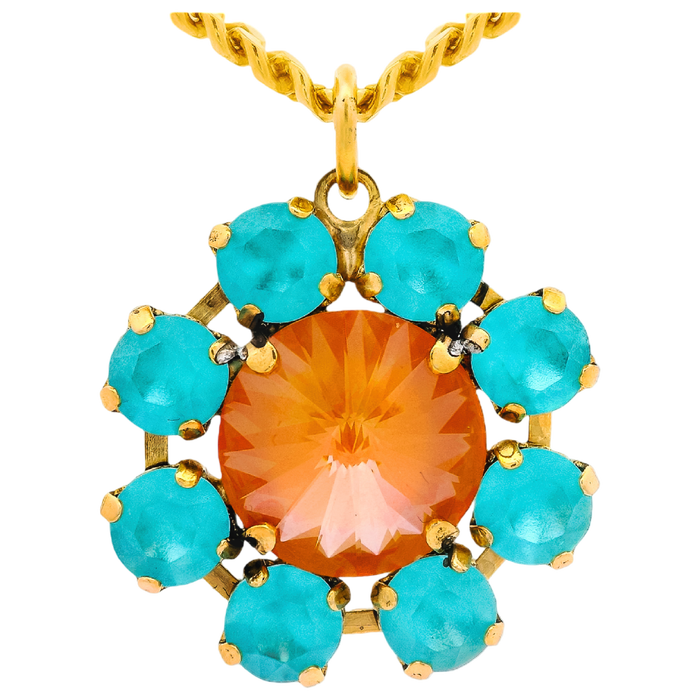 Gold pendant with orange central stone and turquoise stones on a white background